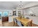 Bright dining room with access to the kitchen and living area that features modern décor and ample storage at 1862 Mallard Dr, Superior, CO 80027