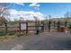 Community dog park entrance featuring a sign, gate, and open space with fencing at 1862 Mallard Dr, Superior, CO 80027
