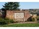 Community entrance sign surrounded by landscaping and green grass at 1862 Mallard Dr, Superior, CO 80027