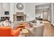 Relaxing community lounge area with stone fireplace, comfortable seating, and views of the lush surroundings at 1862 Mallard Dr, Superior, CO 80027