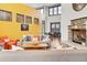 Bright and welcoming community lounge area with high ceilings, stone fireplace, and modern furnishings at 1862 Mallard Dr, Superior, CO 80027