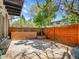 Private patio with a wooden fence and a built-in planter box provides a secluded outdoor space for relaxation and entertaining at 3061 W 92Nd Ave # 14A, Westminster, CO 80031