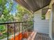 Balcony view surrounded by lush greenery and mature trees at 3061 W 92Nd Ave # 14A, Westminster, CO 80031