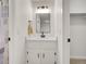 Clean bathroom featuring a single vanity, framed mirror, and modern lighting at 3061 W 92Nd Ave # 14A, Westminster, CO 80031