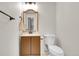 Bathroom with a vanity, wooden framed mirror, and toilet at 3061 W 92Nd Ave # 14A, Westminster, CO 80031