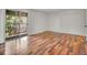 Spacious bedroom with wood floors, a sliding glass door, and closet at 3061 W 92Nd Ave # 14A, Westminster, CO 80031