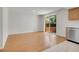 Dining room with hardwood floors, a sliding glass door to the backyard, and stainless steel appliances at 3061 W 92Nd Ave # 14A, Westminster, CO 80031