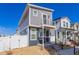 Charming two-story home featuring a modern design and inviting front porch at 5043 N Walden Way, Denver, CO 80249