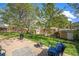 Lush backyard featuring green lawn, mature trees, sheds, and garden beds perfect for outdoor relaxation and gardening at 6132 W 113Th Ave, Westminster, CO 80020