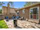 An inviting backyard patio with an outdoor grilling area, comfortable seating, and a view of the well-maintained backyard at 6132 W 113Th Ave, Westminster, CO 80020