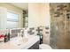 Bathroom featuring a vanity with single sink, a glass enclosed shower, and decorative mosaic tile at 6132 W 113Th Ave, Westminster, CO 80020