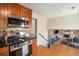 Well-equipped kitchen with stainless steel appliances and upper level view at 6132 W 113Th Ave, Westminster, CO 80020