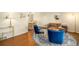 Cozy living room with blue chairs, a round gold table and decorative rug at 6132 W 113Th Ave, Westminster, CO 80020