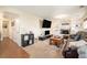 Inviting living area with built-in shelves, a fireplace, a large TV, and comfortable seating at 6132 W 113Th Ave, Westminster, CO 80020