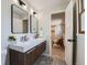 Modern bathroom featuring a double vanity, sleek mirrors, and stylish wood accents at 4682 Chatham St, Boulder, CO 80301