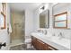 Modern bathroom featuring double sink vanity, large walk-in shower with frameless glass at 4682 Chatham St, Boulder, CO 80301