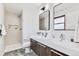 Modern bathroom with a double vanity, updated fixtures, and walk-in shower at 4682 Chatham St, Boulder, CO 80301