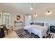 Bright bedroom with a clean minimalist design featuring an ensuite bathroom entrance at 4682 Chatham St, Boulder, CO 80301