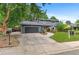 Charming two-story home featuring a two-car garage, brick accents, and a well-manicured front yard with mature trees at 4682 Chatham St, Boulder, CO 80301