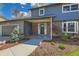 Charming two-story home features a brick facade, covered entry, and well-manicured landscaping at 4682 Chatham St, Boulder, CO 80301