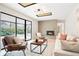 Bright living room featuring large windows, modern fireplace, and cozy seating area at 4682 Chatham St, Boulder, CO 80301