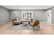 Comfortable living room with a neutral color scheme, bay window, modern furnishings, and hardwood flooring at 4682 Chatham St, Boulder, CO 80301