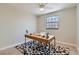 Bright office featuring sleek wooden desk, patterned rug, and modern ceiling fan at 4682 Chatham St, Boulder, CO 80301