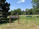 View of the Parker Park neighborhood park with sign, grass, and park bench at 4682 Chatham St, Boulder, CO 80301