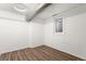 Finished basement with recessed lighting, window, and laminated floors at 3306 N Gilpin St, Denver, CO 80205