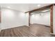 Spacious finished basement showcasing wood-look floors, and modern accents at 3306 N Gilpin St, Denver, CO 80205