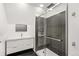 Modern bathroom featuring stylish vanity, tiled floors, and glass enclosed shower at 3306 N Gilpin St, Denver, CO 80205