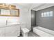 Modern bathroom with new sink, vanity, and a combined tub and shower at 3306 N Gilpin St, Denver, CO 80205