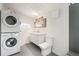 Bathroom featuring a stackable washer/dryer and modern fixtures at 3306 N Gilpin St, Denver, CO 80205