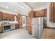 Well-equipped kitchen with stainless steel appliances and breakfast bar at 3306 N Gilpin St, Denver, CO 80205