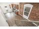 Open kitchen with stainless steel appliances and exposed brick accent wall at 3306 N Gilpin St, Denver, CO 80205