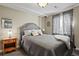 Bedroom with neutral walls, plush carpet, a padded headboard, and natural light at 10153 Pagosa St, Commerce City, CO 80022