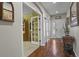 Welcoming home entryway featuring hardwood floors with an office through glass paneled doors at 10153 Pagosa St, Commerce City, CO 80022