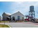 Community recreation center with a water tower and playground, situated near a paved road at 10153 Pagosa St, Commerce City, CO 80022