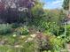 Lush garden featuring a diverse array of plants and greenery, creating a serene and inviting outdoor space at 10153 Pagosa St, Commerce City, CO 80022