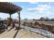 Inviting outdoor patio space with pergola and views of the surrounding neighborhood and open sky at 10153 Pagosa St, Commerce City, CO 80022