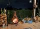 A rustic chiminea provides warmth and ambiance on this inviting patio, perfect for cool evenings at 10153 Pagosa St, Commerce City, CO 80022