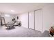 Spacious basement featuring comfortable seating area, large closet, and modern decor at 3045 Kearny Street, Denver, CO 80207