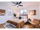 Cozy bedroom with neutral tones, stylish decor, ceiling fan, and bright natural light at 3045 Kearny Street, Denver, CO 80207