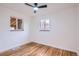 Bright bedroom featuring hardwood floors, natural light, and modern ceiling fan at 3045 Kearny Street, Denver, CO 80207