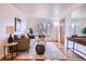 Bright living room with hardwood floors, modern decor, and ample natural light at 3045 Kearny Street, Denver, CO 80207