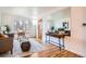 Cozy living room with hardwood floors, large window, and a decorative mirror at 3045 Kearny Street, Denver, CO 80207