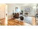 Bright living room with hardwood floors, neutral colors, large windows, and stylish furniture at 3045 Kearny Street, Denver, CO 80207