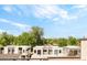 Community with modern townhomes, mature trees and blue sky at 3957 Utica St, Denver, CO 80212