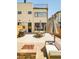 Backyard patio with outdoor seating, a grill, and access to the interior through sliding glass doors at 3957 Utica St, Denver, CO 80212