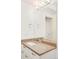 Bright bathroom featuring a large mirror, modern lighting, and a sink with quartz countertops at 3957 Utica St, Denver, CO 80212